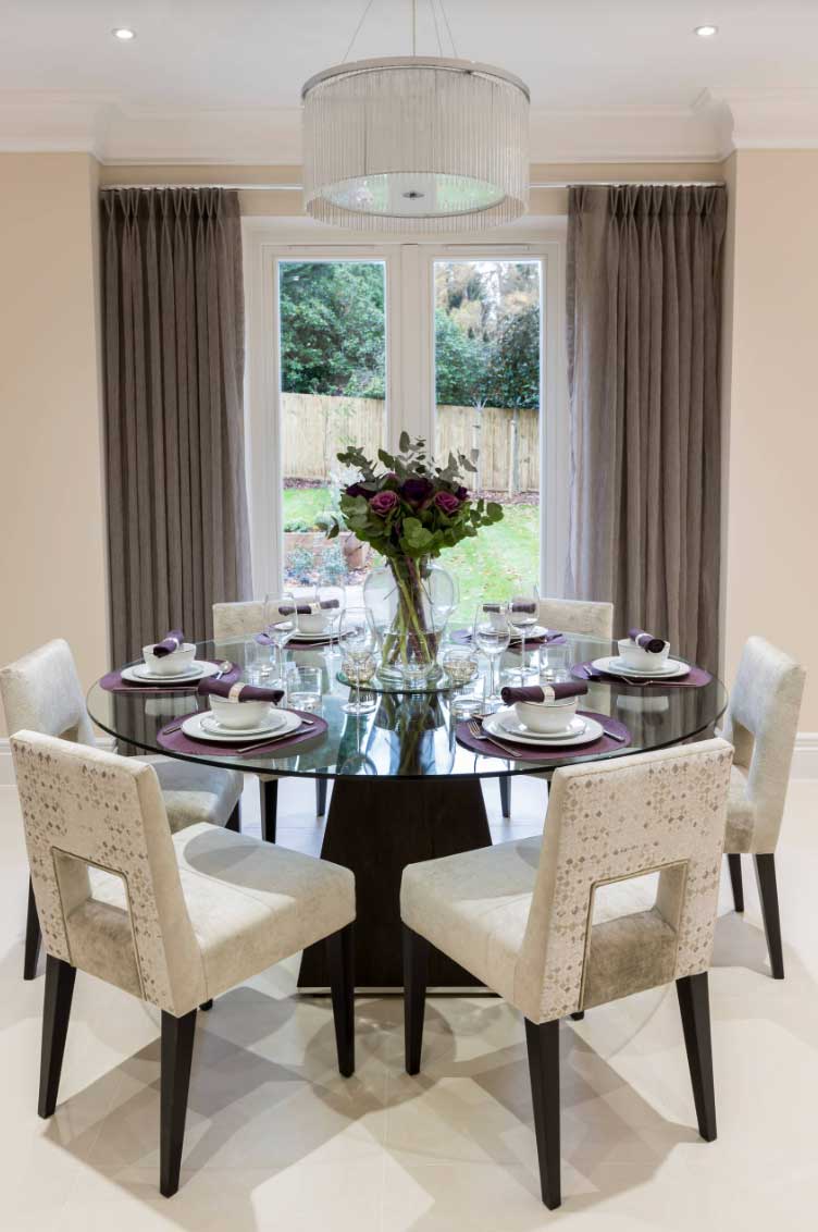 contemporary dining room with double doors half covered with curtains