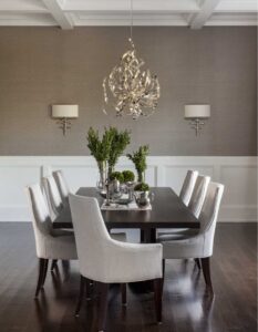 neutral colored dining room design with grasscloth wallpaper