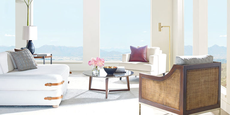 Bare floor to ceiling windows in living room.