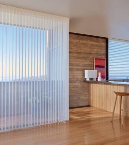Vertical sheer shades on patio window next to custom bar space
