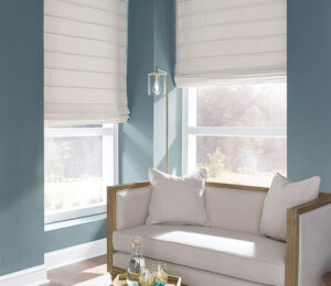 cream fabric shades in corner window blue walls and settee in Waukesha