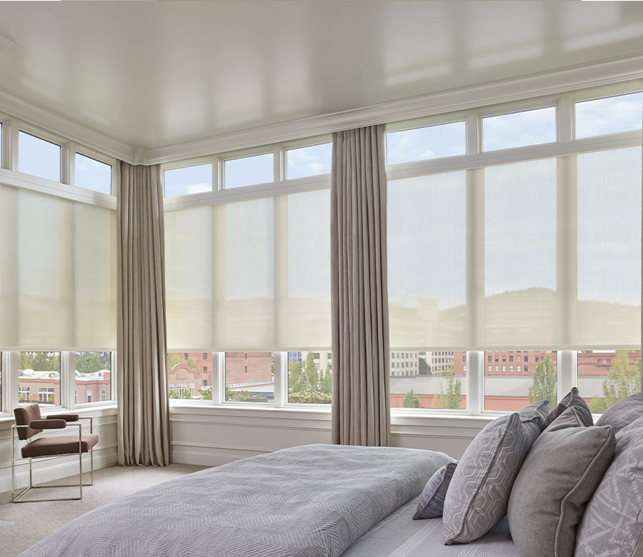 see through solar shades layered with drapery in Milwaukee bedroom