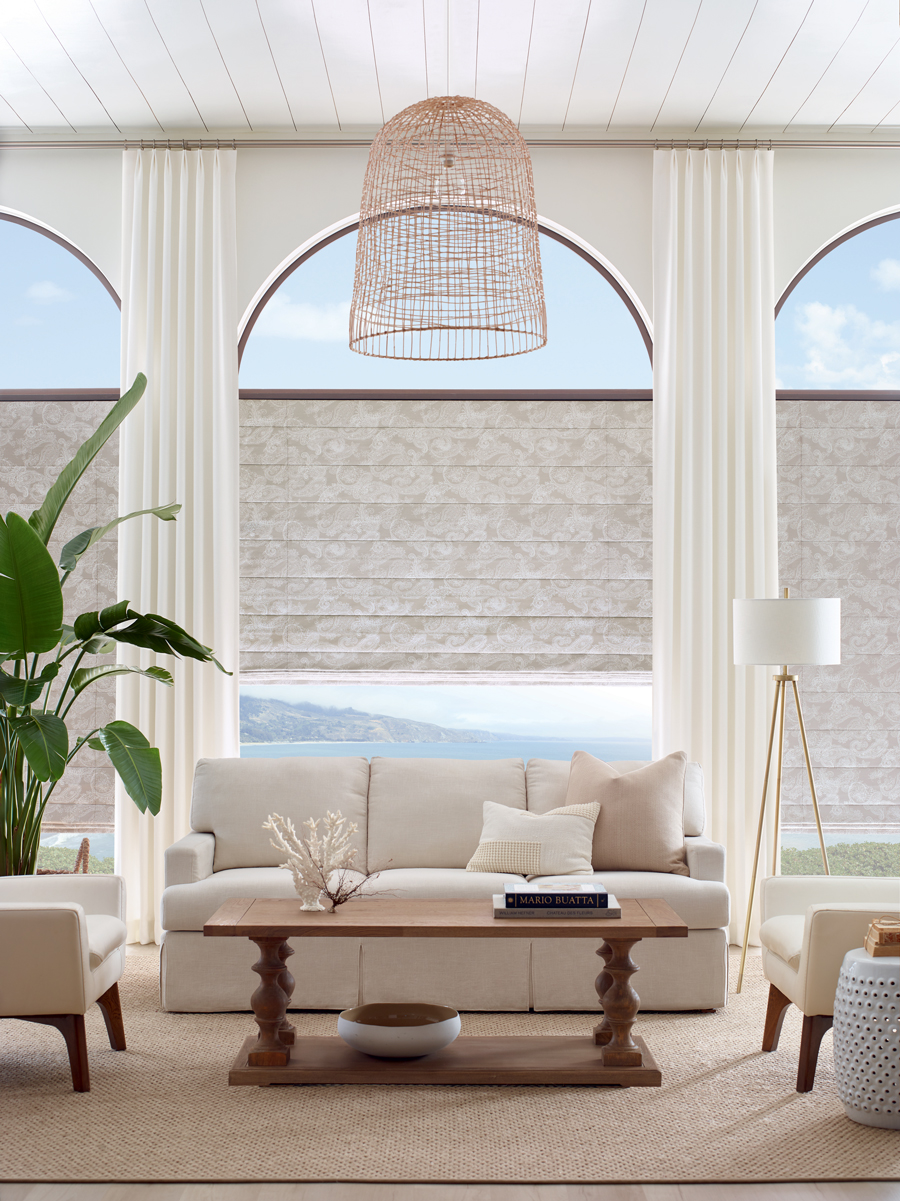 Custom Roman shades and drapery on arched specialty windows