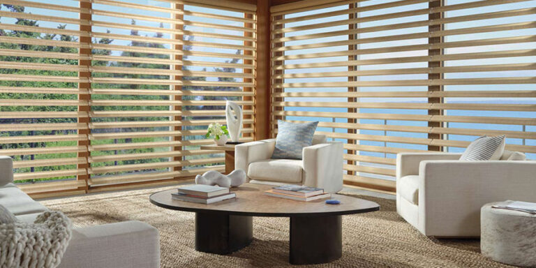 Pirouette® shades filtering natural light across large living room windows
