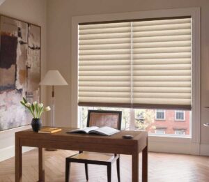 roman shades on large window behind desk in office nook