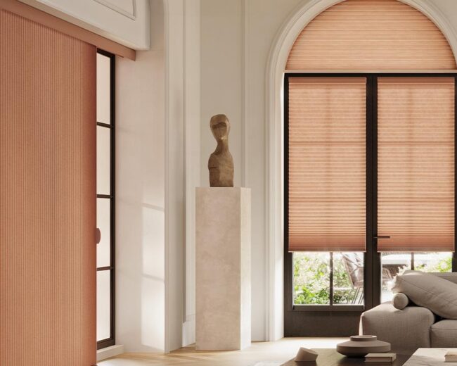 living room with peach vertical cellular shades duette vertiglide