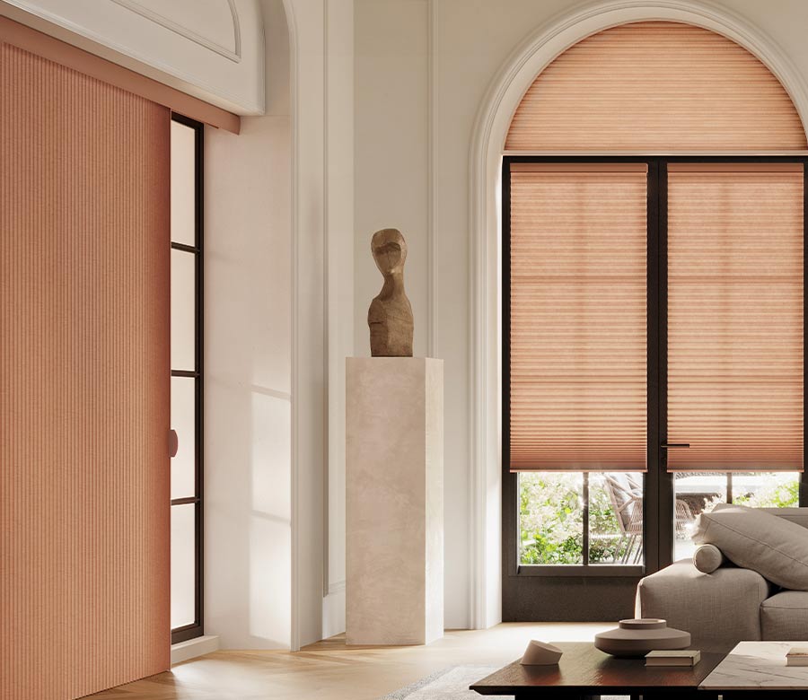 living room with peach vertical cellular shades duette vertiglide