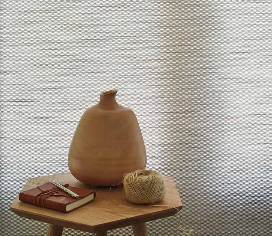 white designer roller shades with decor on table