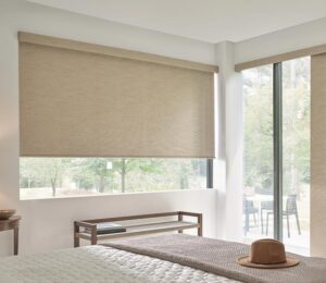 cream designer roller shades window covering in bedroom