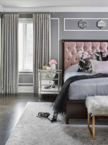 bedroom with gray walls and pink headboard