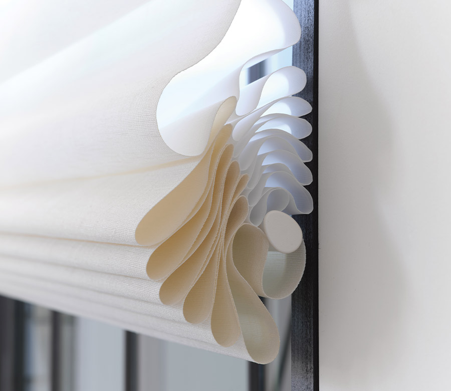 vignette-stacking-detail-roman-shades-hunter-douglas-bazaar-home-decorating Folded fabric detailing on modern Roman shade