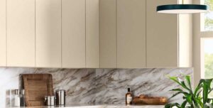 neutral cabinets with a marble backsplash