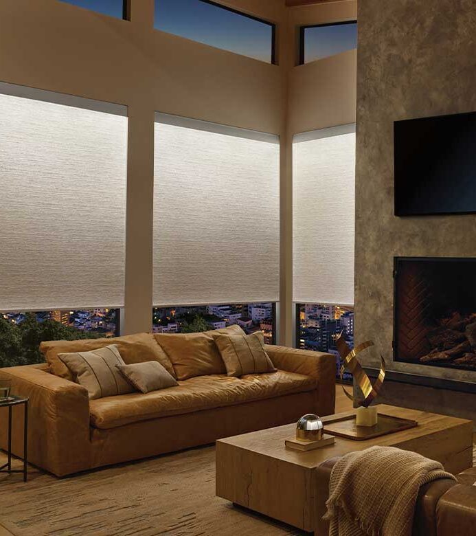 aura-illuminated-shades-soft-led-lighted-roller-shade-hunter-douglas-bazaar-home-decorating Aura Illuminated Shades softly glowing in living room