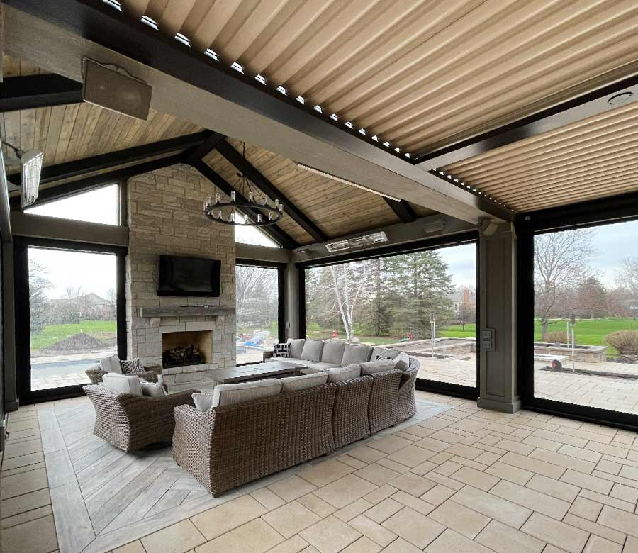 Custom outdoor roller shades installed on a covered patio in the Milwaukee area